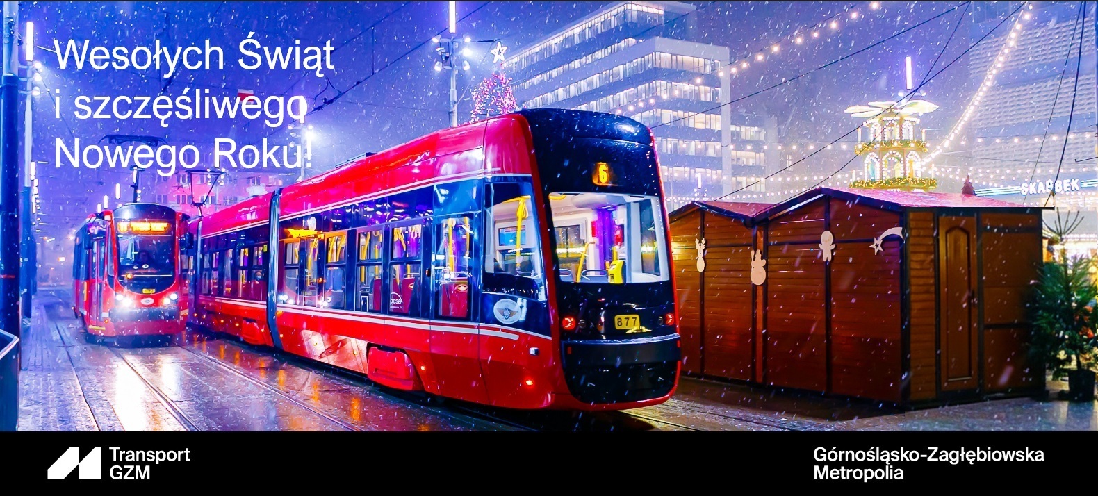 Tramwaje w centrum Katowic w świątecznej scenerii oraz napis z życzeniami świątecznymi